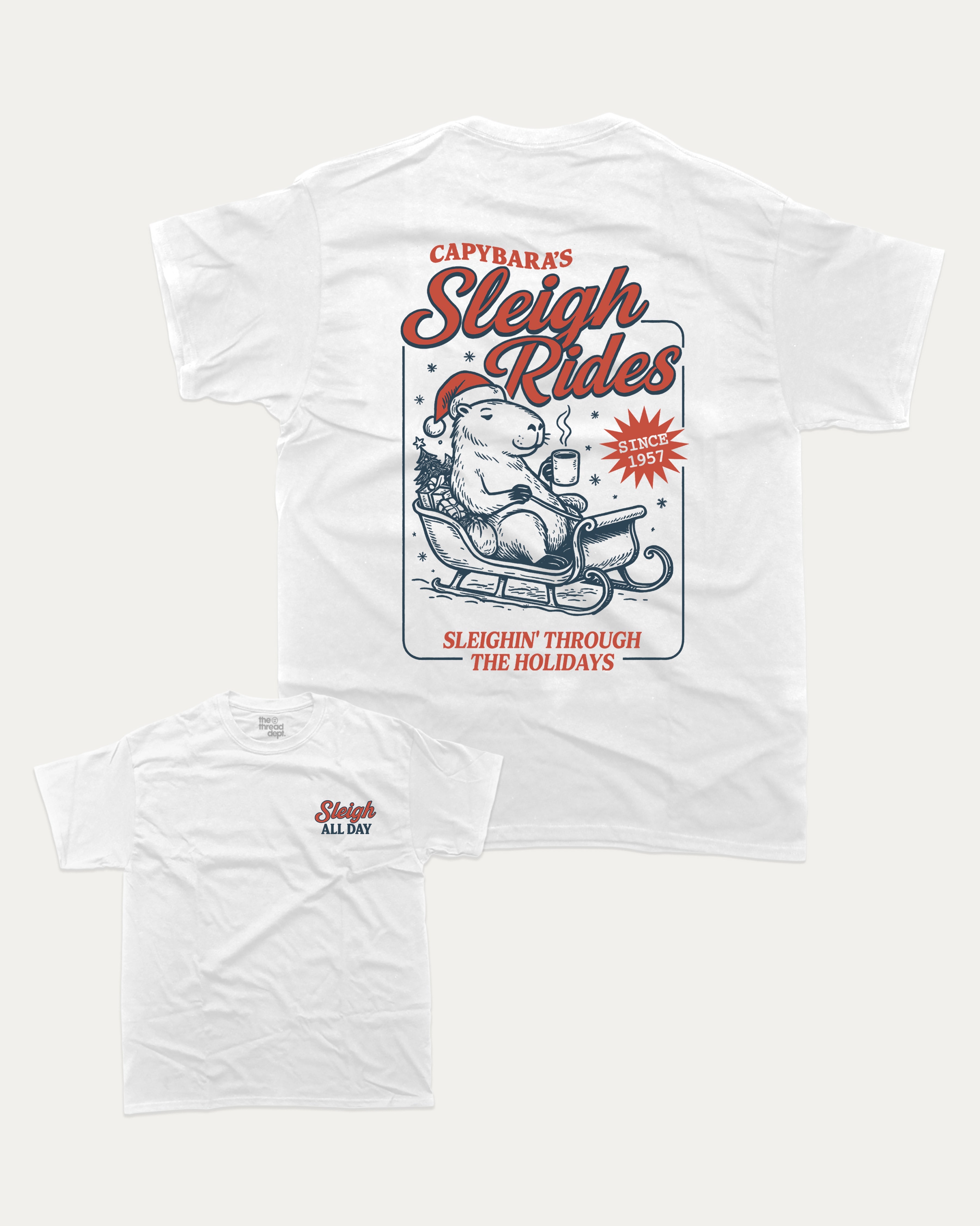 Capybara's Sleigh Rides graphic tee with bold and humorous print, Perfect Gift for Christmas, X Mas Graphic T shirt, X-mas Gift, funny and trendy graphic. Perfect for adults and gift-giving. White shirt.