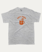 Cozy Vibes graphic tee with bold and humorous print, Perfect Gift for Christmas, Gift for X mas Day,  funny and trendy graphic. Perfect for adults and gift-giving. Heather Grey shirt.