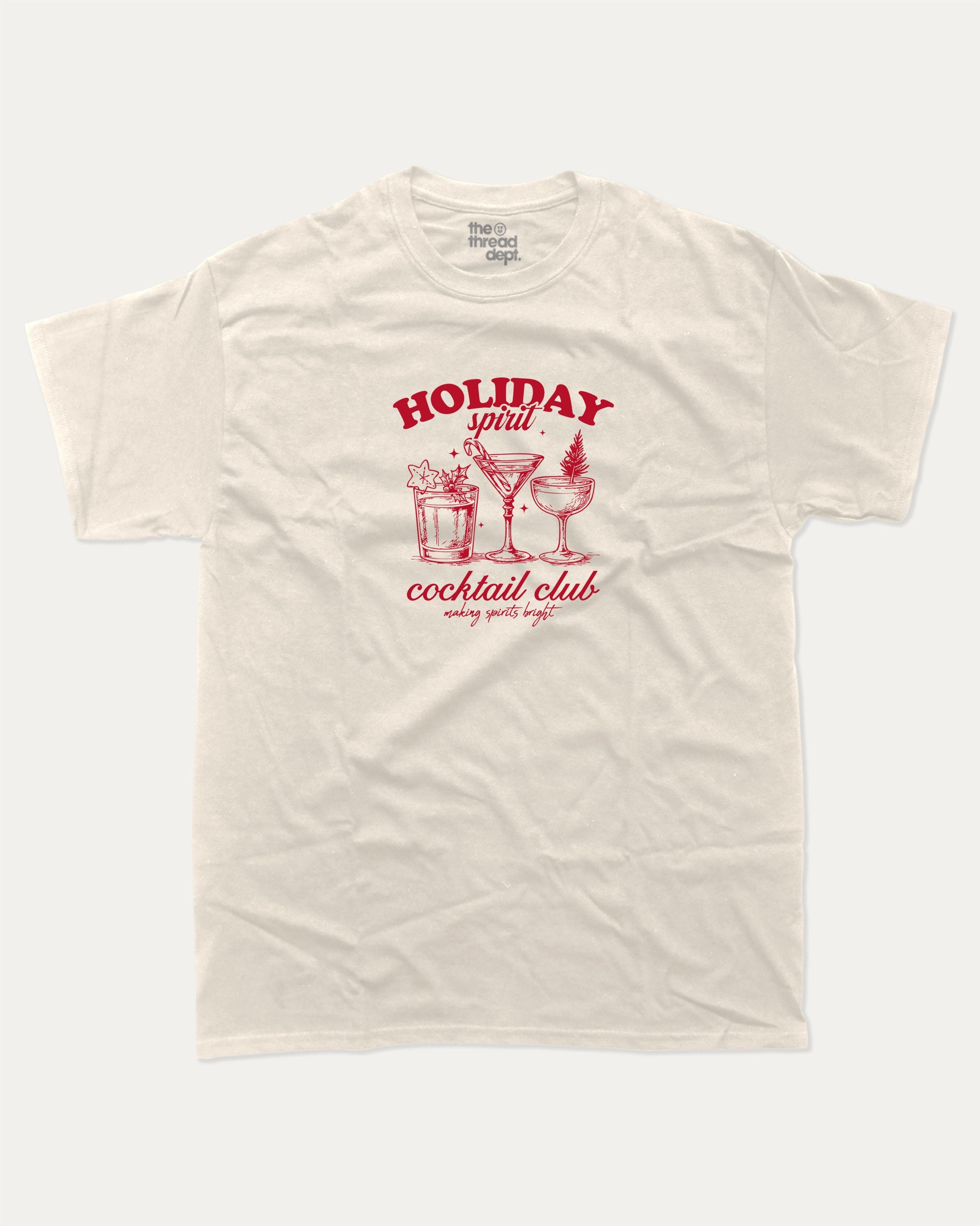 Holiday Spirit Cocktail Club graphic tee with bold and humorous print, funny and trendy graphic. Christmas Gift T shirt, X-mas Graphic T shirt, Drinks lover T shirt,  Perfect for adults and gift-giving. Cream shirt.