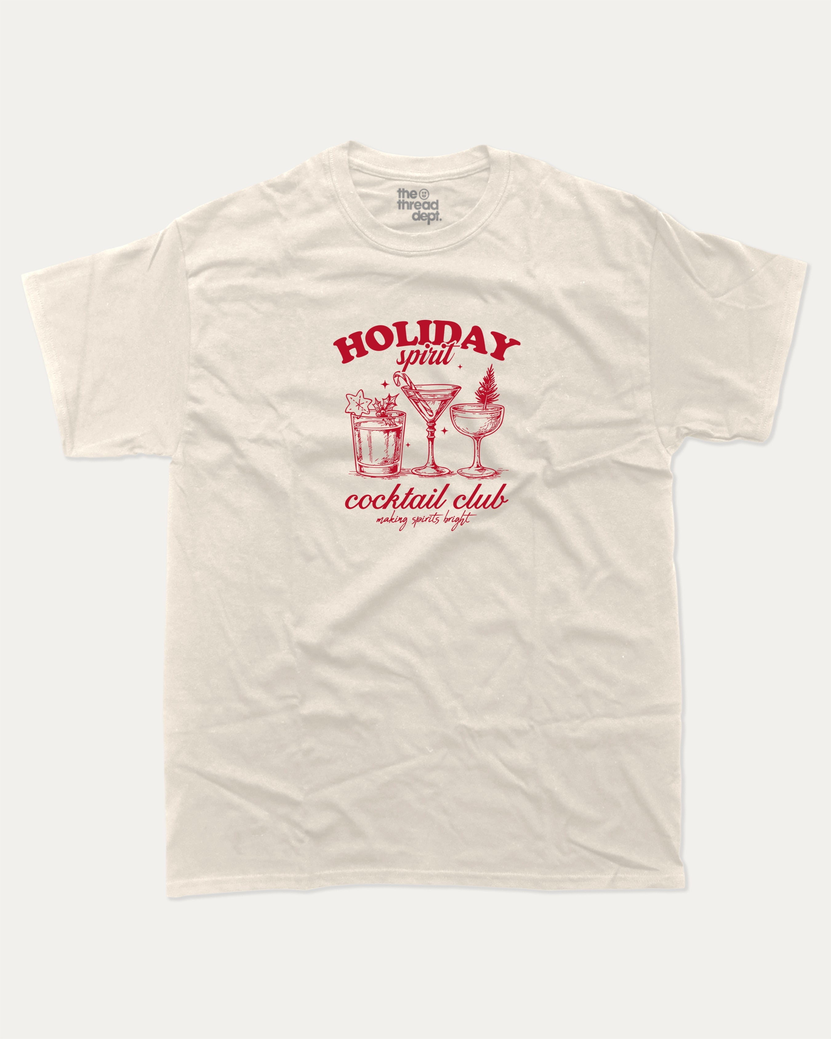 Holiday Spirit Cocktail Club graphic tee with bold and humorous print, funny and trendy graphic. Christmas Gift T shirt, X-mas Graphic T shirt, Drinks lover T shirt,  Perfect for adults and gift-giving. Cream shirt.