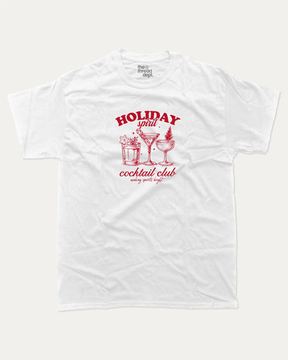 Holiday Spirit Cocktail Club graphic tee with bold and humorous print, funny and trendy graphic. Christmas Gift T shirt, X-mas Graphic T shirt, Drinks lover T shirt,  Perfect for adults and gift-giving. White shirt.