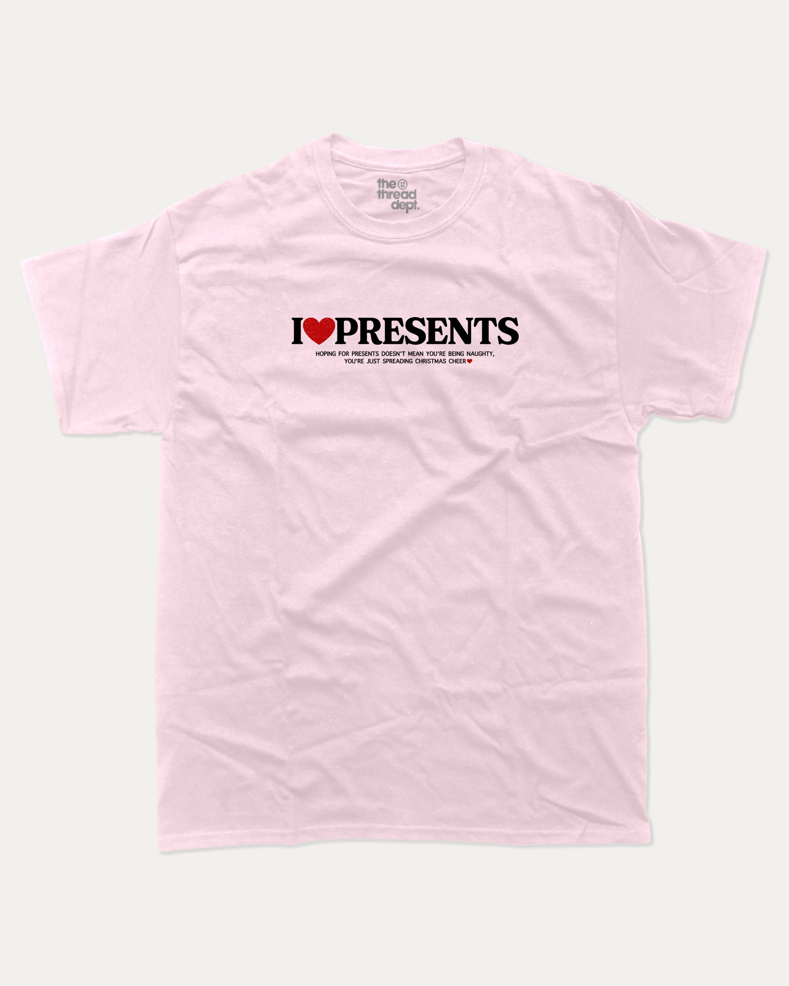 I Love Presents graphic tee with bold and humorous print, funny and trendy graphic. Perfect Gift for Christmas, x-mas gift,  Perfect for adults and gift-giving. Pink shirt.
