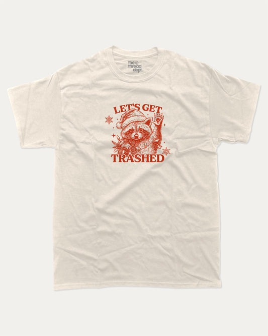 Let's Get Trashed graphic tee with bold and humorous print, Perfect Gift for Christmas, X Mas Graphic T shirt, X-mas Gift, funny and trendy graphic. Perfect for adults and gift-giving. Cream shirt.