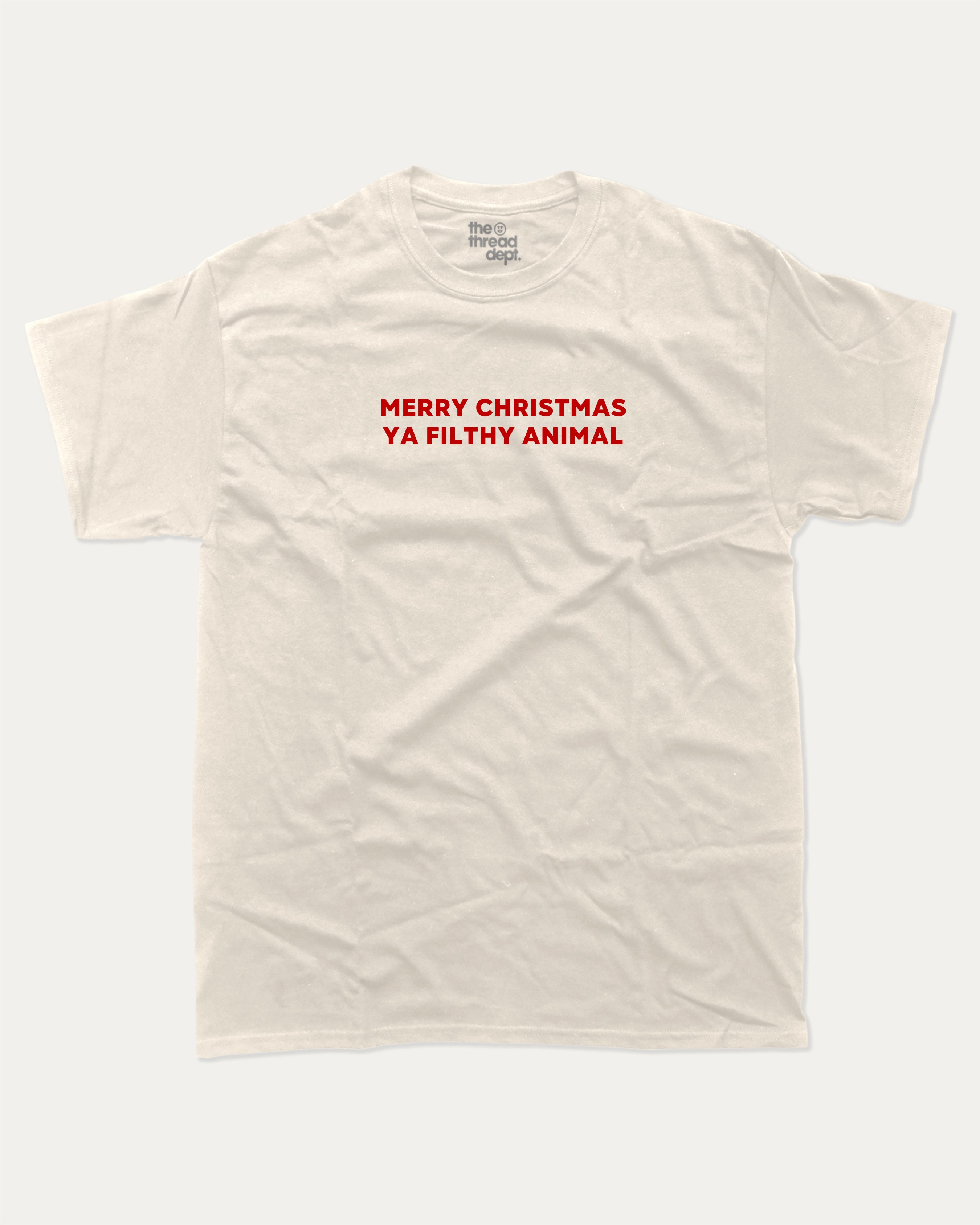 Merry Christmas Ya Filthy Animal graphic tee with bold and humorous print, Perfect Gift for Christmas, X Mas Graphic T shirt, X-mas Gift, funny and trendy graphic. Perfect for adults and gift-giving. Cream shirt.