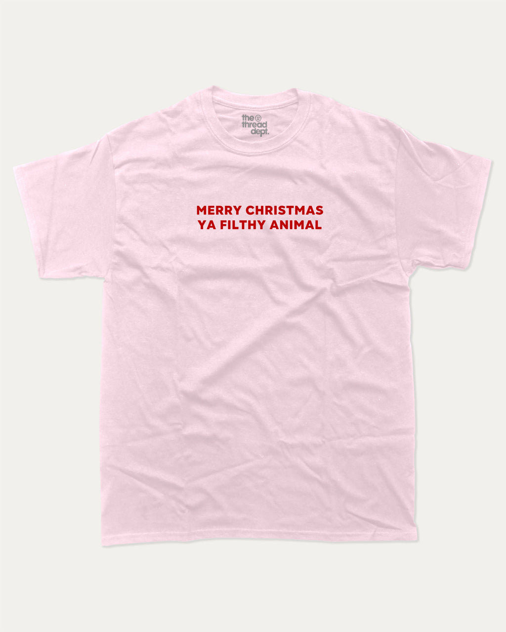 Merry Christmas Ya Filthy Animal graphic tee with bold and humorous print, Perfect Gift for Christmas, X Mas Graphic T shirt, X-mas Gift, funny and trendy graphic. Perfect for adults and gift-giving. Pink shirt.