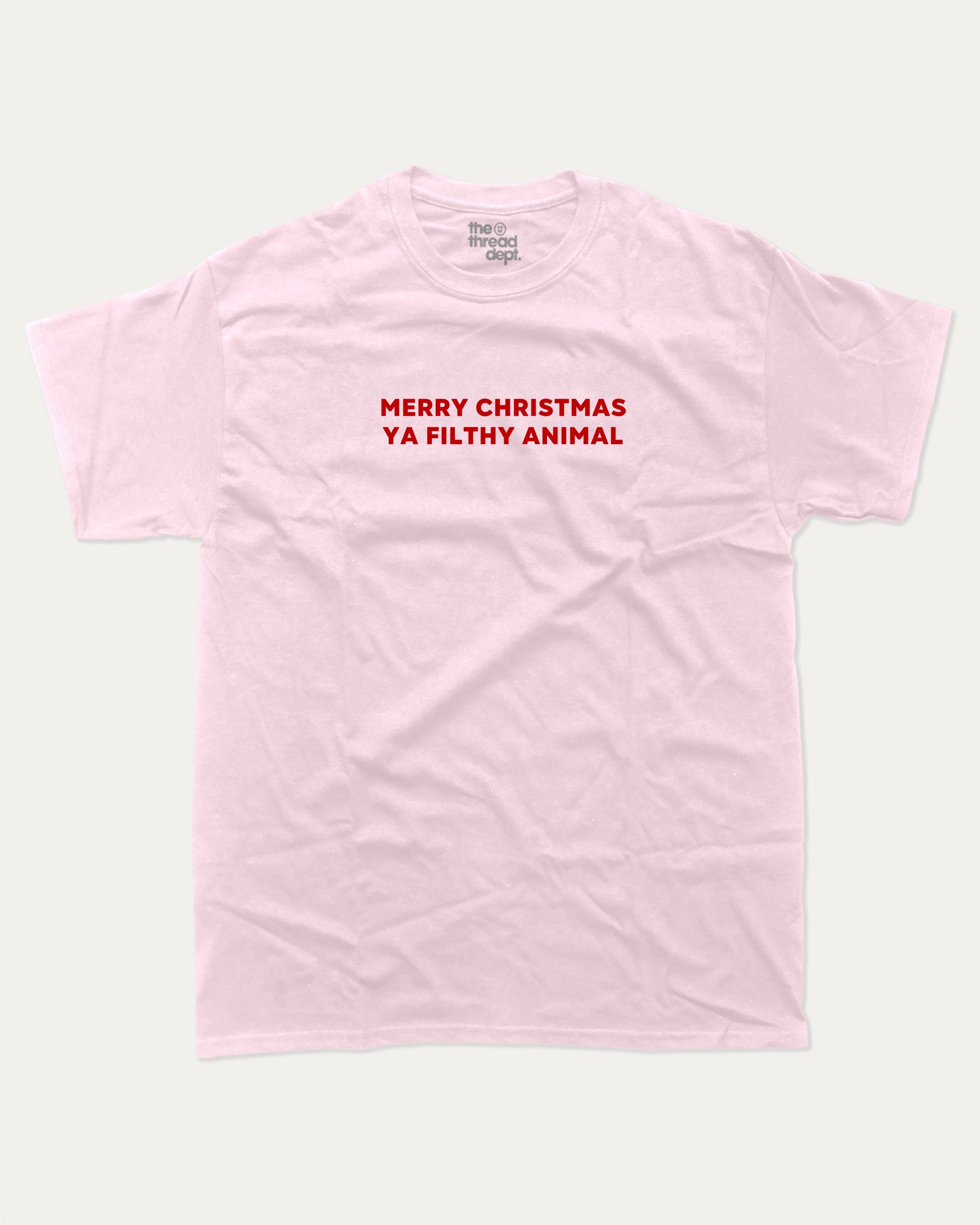 Merry Christmas Ya Filthy Animal graphic tee with bold and humorous print, Perfect Gift for Christmas, X Mas Graphic T shirt, X-mas Gift, funny and trendy graphic. Perfect for adults and gift-giving. Pink shirt.