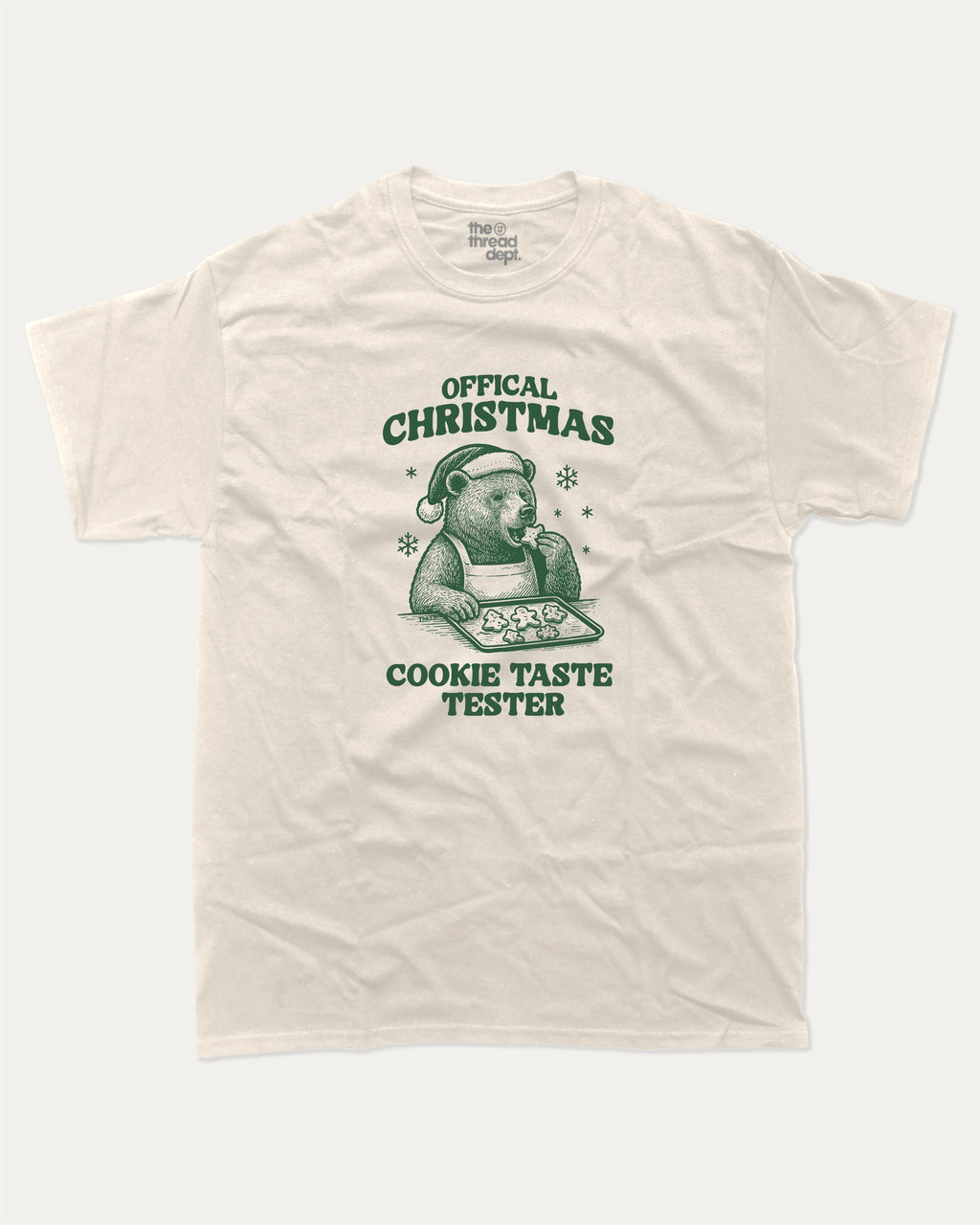 Official Christmas Cookie Taste Tester graphic tee with bold and humorous print, funny and trendy graphic. Perfect Gift for Christmas, X-Mas Gift,  Perfect for adults and gift-giving. Cream shirt.