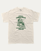 Official Christmas Cookie Taste Tester graphic tee with bold and humorous print, funny and trendy graphic. Perfect Gift for Christmas, X-Mas Gift,  Perfect for adults and gift-giving. Cream shirt.