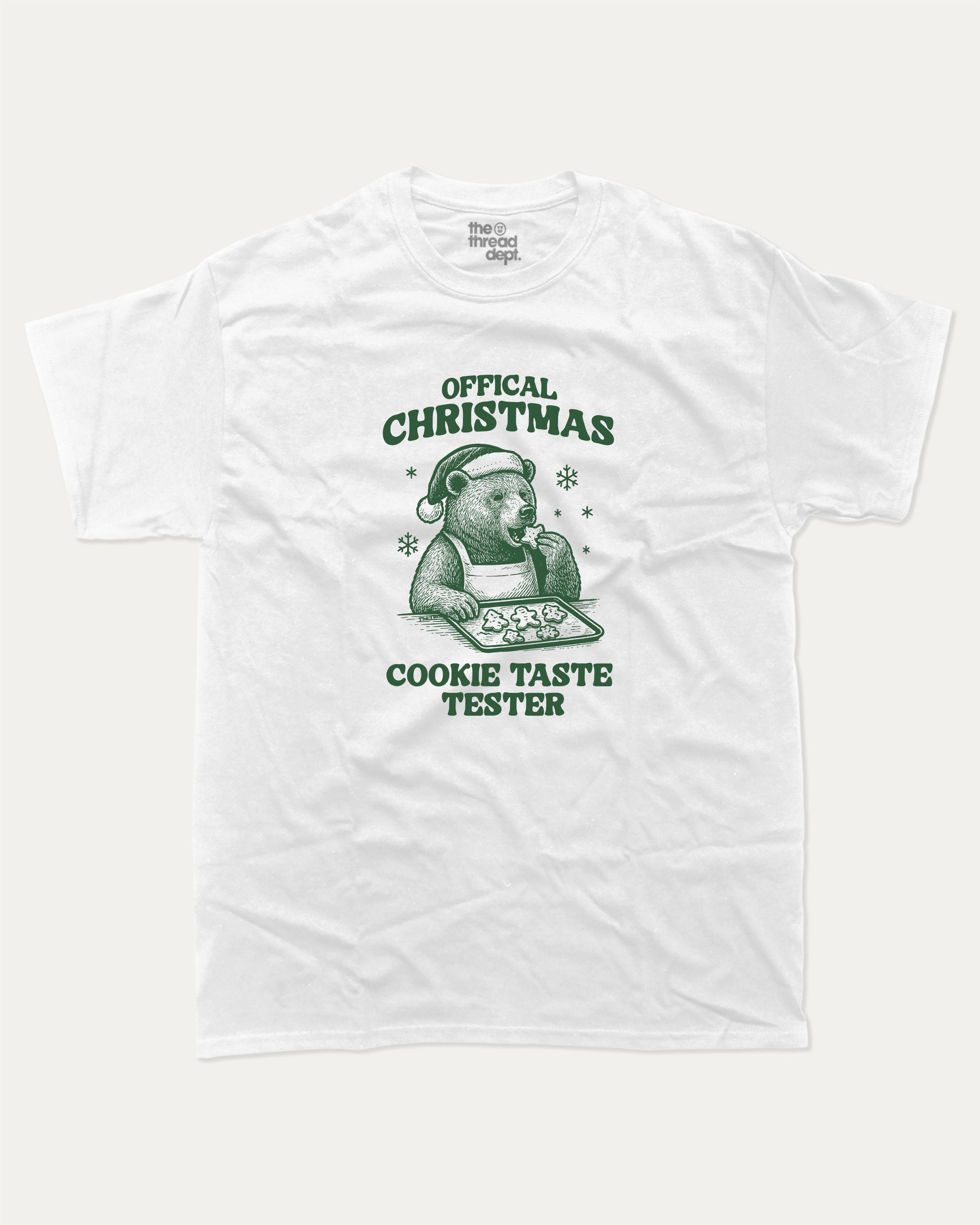 Official Christmas Cookie Taste Tester graphic tee with bold and humorous print, funny and trendy graphic. Perfect Gift for Christmas, X-Mas Gift,  Perfect for adults and gift-giving. White shirt.