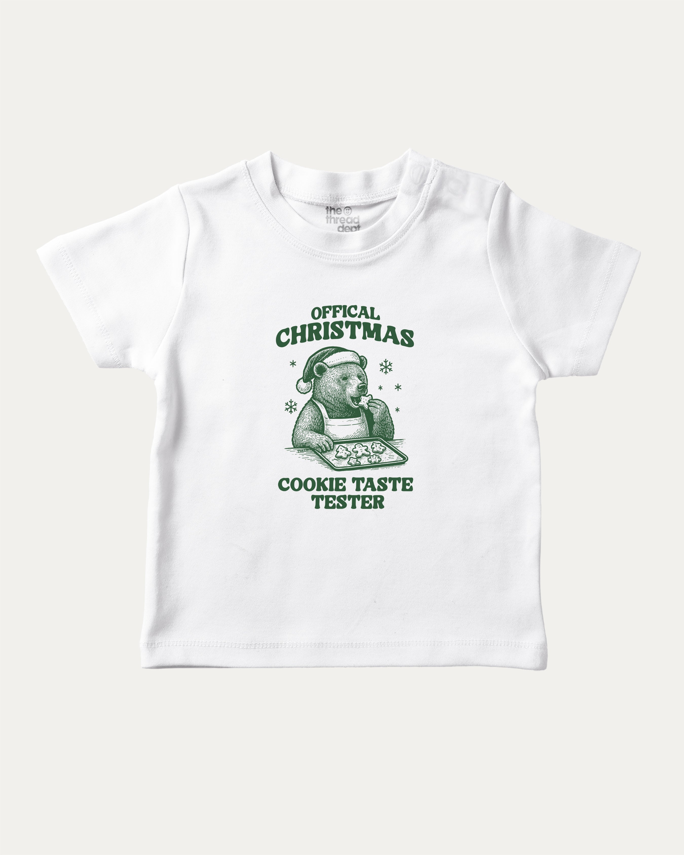 Official Christmas Cookie Taste Tester graphic tee with bold and humorous print, funny and trendy graphic. Perfect Gift for Christmas, X-Mas Gift,  Perfect for adults and gift-giving. White shirt.