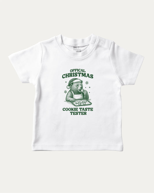 Official Christmas Cookie Taste Tester graphic tee with bold and humorous print, funny and trendy graphic. Perfect Gift for Christmas, X-Mas Gift,  Perfect for adults and gift-giving. White shirt.