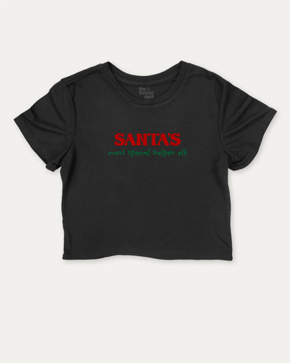 Santa's Most Special Helper graphic crop tee with funny and trendy slogan print, Perfect Gift for Christmas, Christmas Gift, X-mas Gift for friends, perfect for women’s casual looks or layering. Black crop t-shirt.
