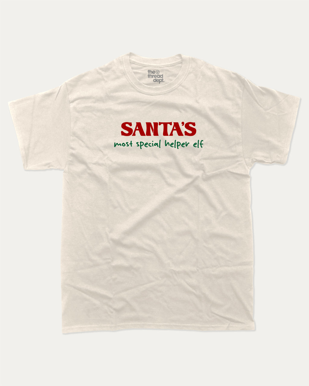 Santa's Most Special Helper graphic tee with bold and humorous print, Perfect Gift for Christmas, Christmas Gift, X-mas Gift for friends, funny and trendy graphic. Perfect for adults and gift-giving. Cream shirt.