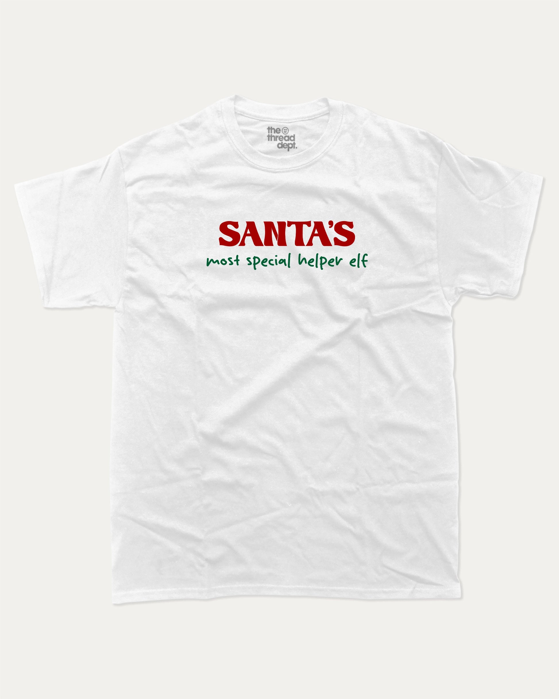 Santa's Most Special Helper graphic tee with bold and humorous print, Perfect Gift for Christmas, Christmas Gift, X-mas Gift for friends, funny and trendy graphic. Perfect for adults and gift-giving. White shirt.