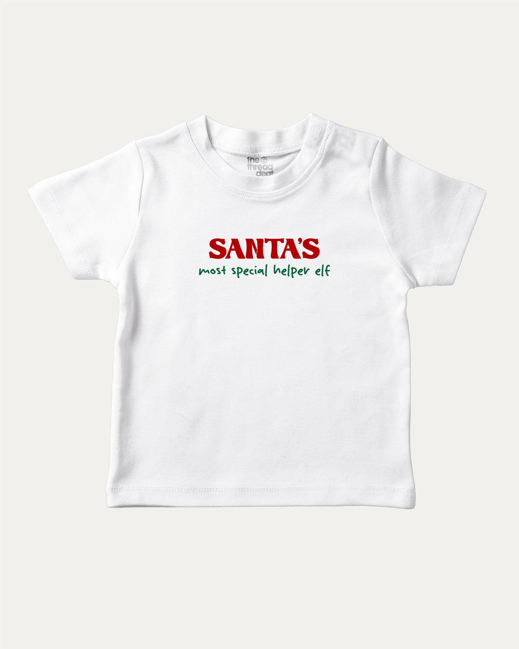 Santa's Most Special Helper graphic tee with bold and humorous print, Perfect Gift for Christmas, Christmas Gift, X-mas Gift for friends, funny and trendy graphic. Perfect for adults and gift-giving. White shirt.