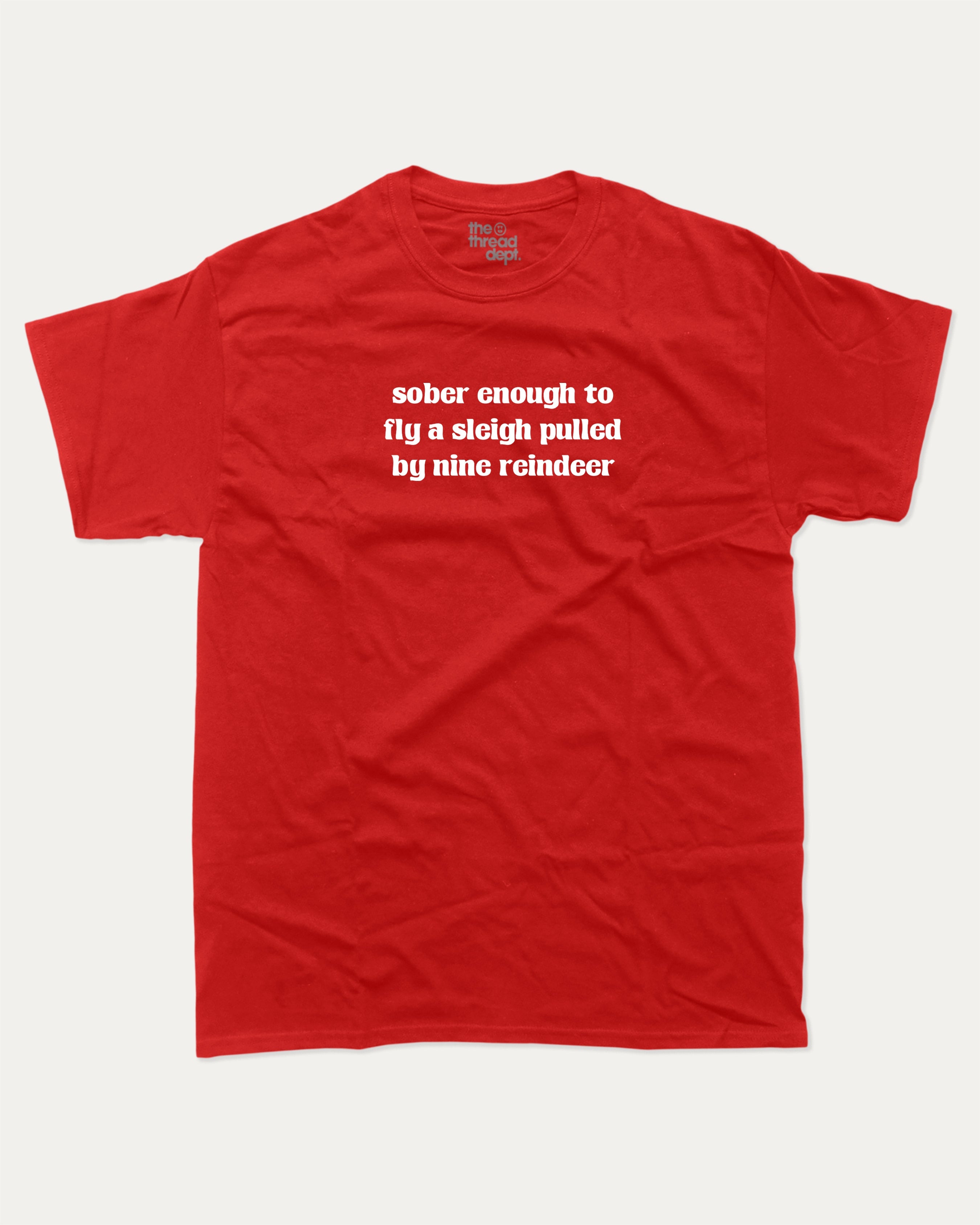 Sober Enough To Fly A Sleigh Pulled By Nine Reindeer graphic tee with bold and humorous print, Perfect Gift for Christmas, X-mas Gift,  funny and trendy graphic. Perfect for adults and gift-giving. Red shirt.