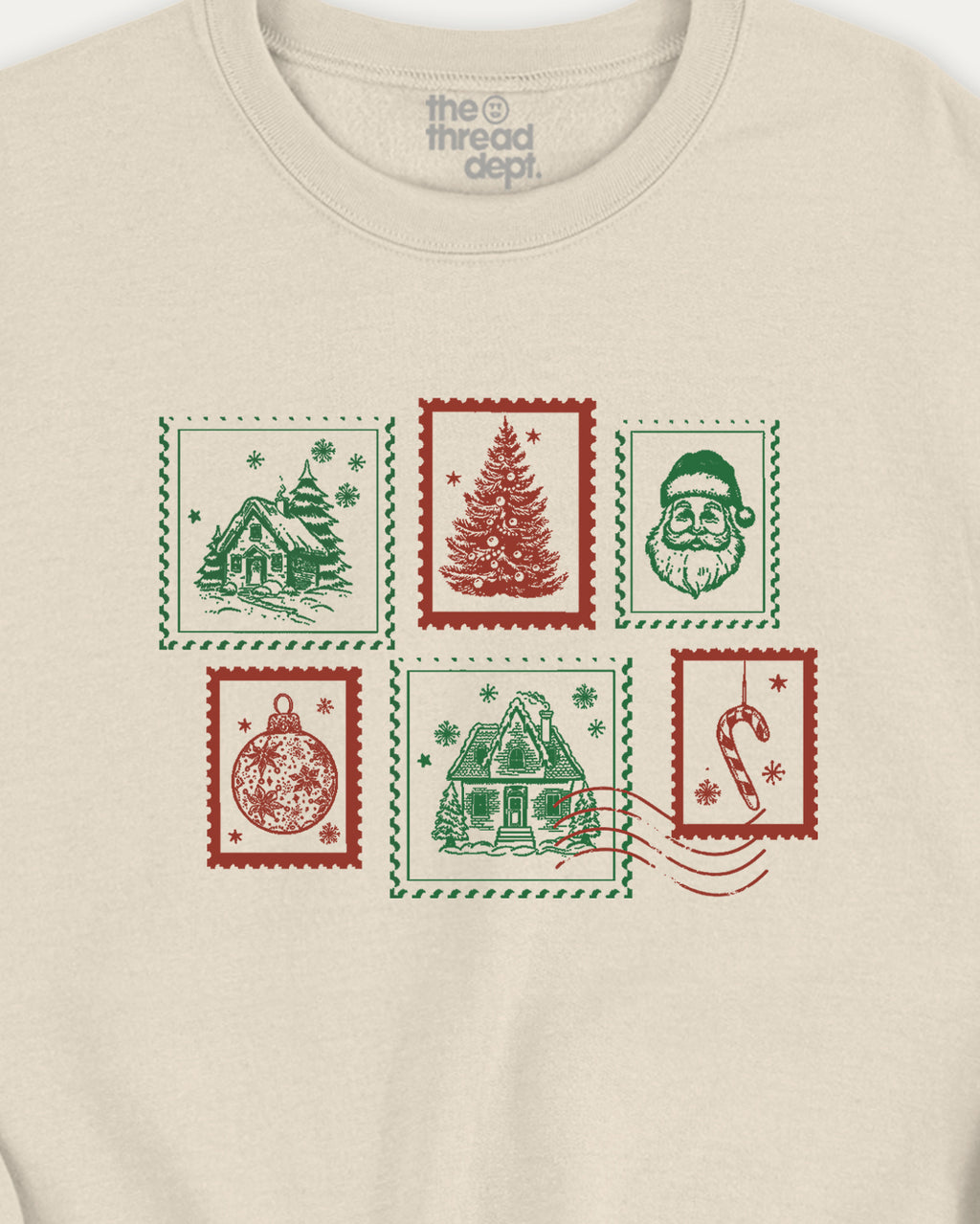 Beige t-shirt with Christmas-themed stamps design on a white background