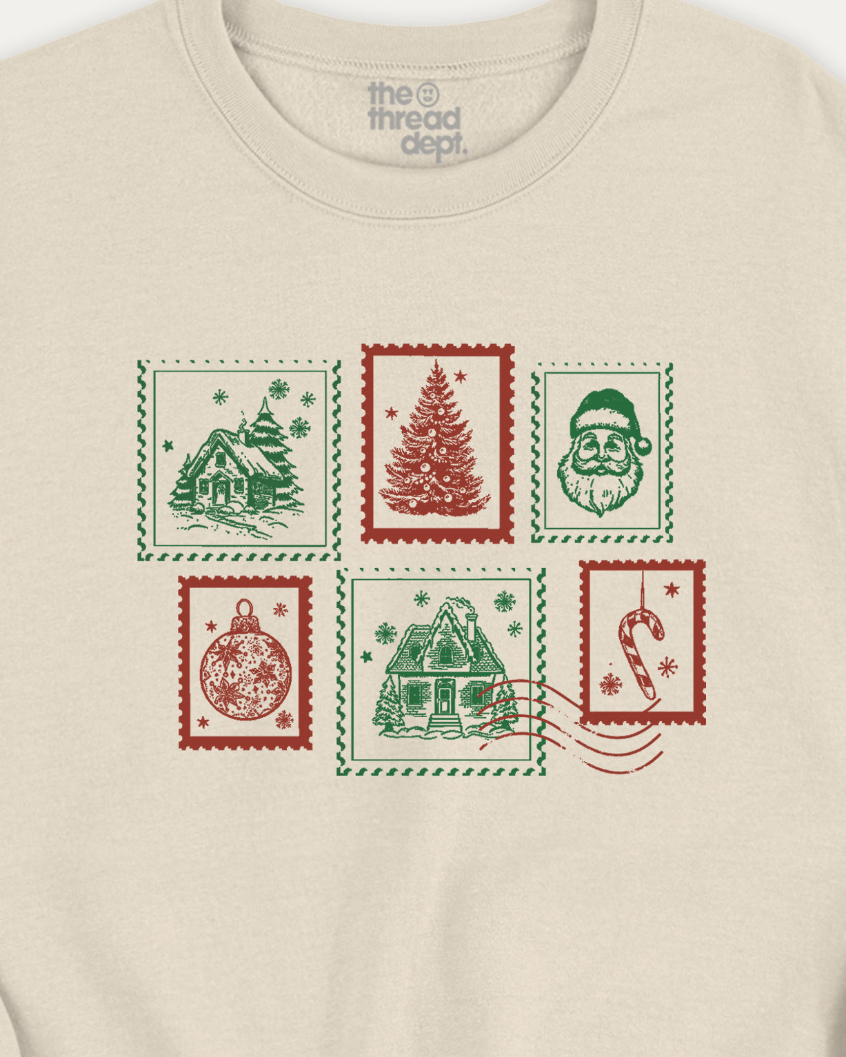 Beige t-shirt with Christmas-themed stamps design on a white background