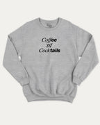 Coffee Til Cocktails graphic sweatshirt with bold and humorous print, Perfect Gift to Coffee Lover, Caffeine Graphic T shirt, warm and cozy graphic for everyday wear. Perfect for adults and gift-giving. Heather Grey pullover.