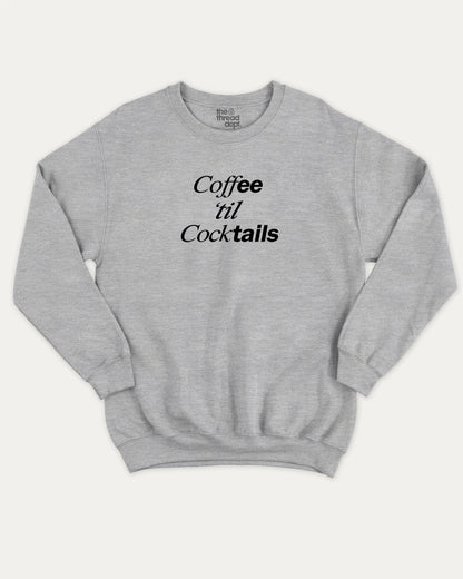 Coffee Til Cocktails graphic sweatshirt with bold and humorous print, Perfect Gift to Coffee Lover, Caffeine Graphic T shirt, warm and cozy graphic for everyday wear. Perfect for adults and gift-giving. Heather Grey pullover.