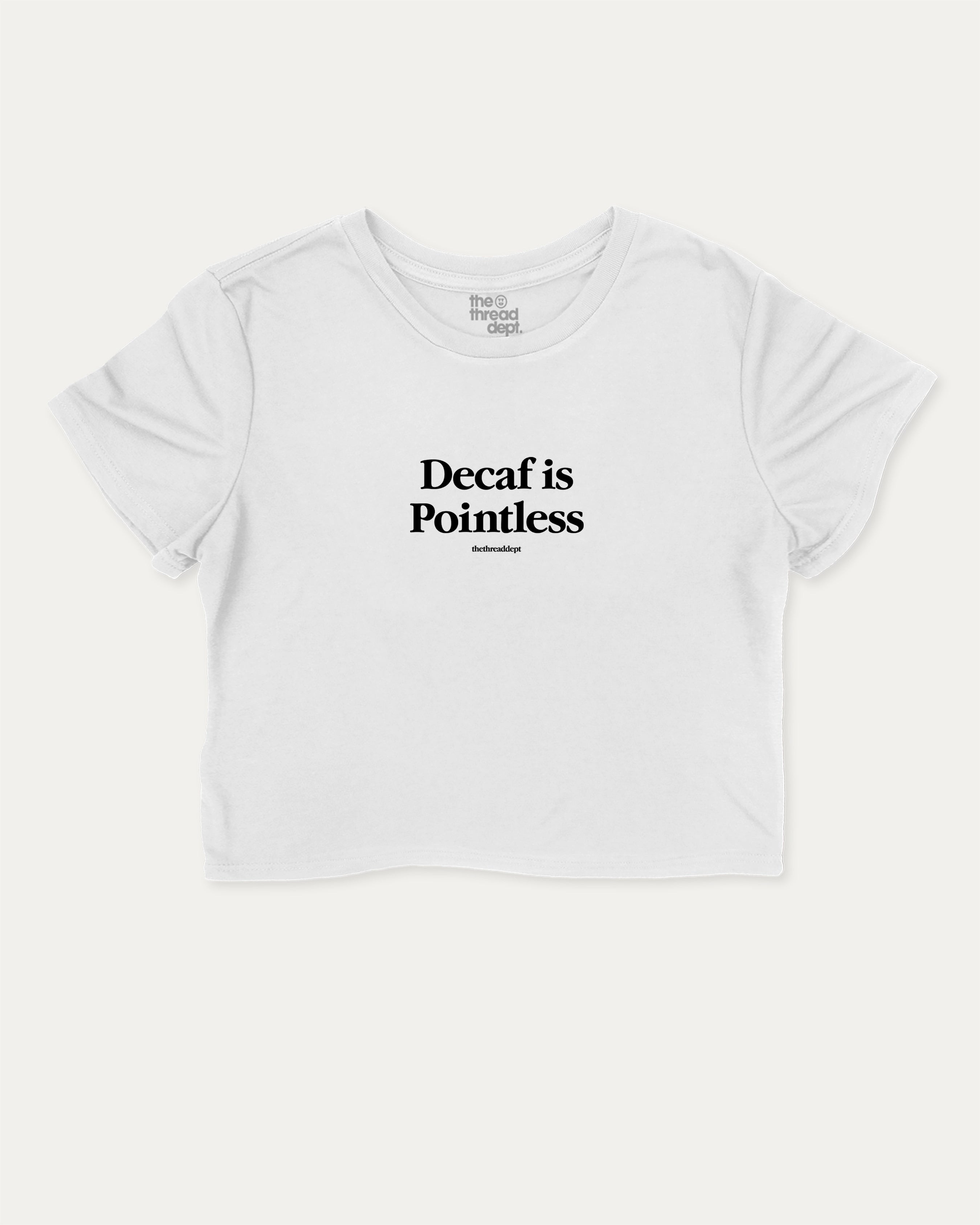 Decaf is Pointless graphic crop tee with funny and trendy slogan print, perfect for women’s casual looks or layering. White crop t-shirt.
