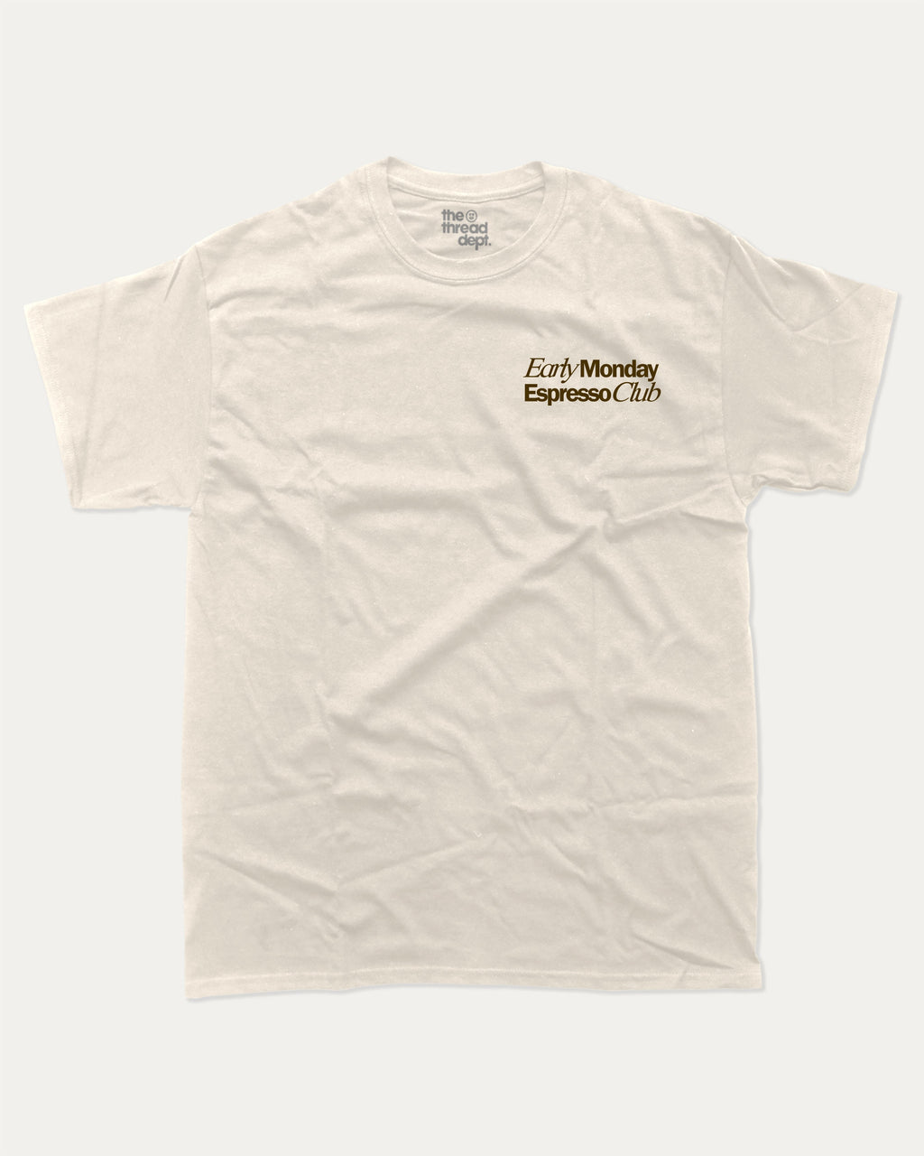 Early Monday Espresso Club graphic tee with bold and humorous print, funny and trendy graphic. Gift for Coffee Lover, Cofee Graphic Tee. Perfect for adults and gift-giving. Cream shirt.