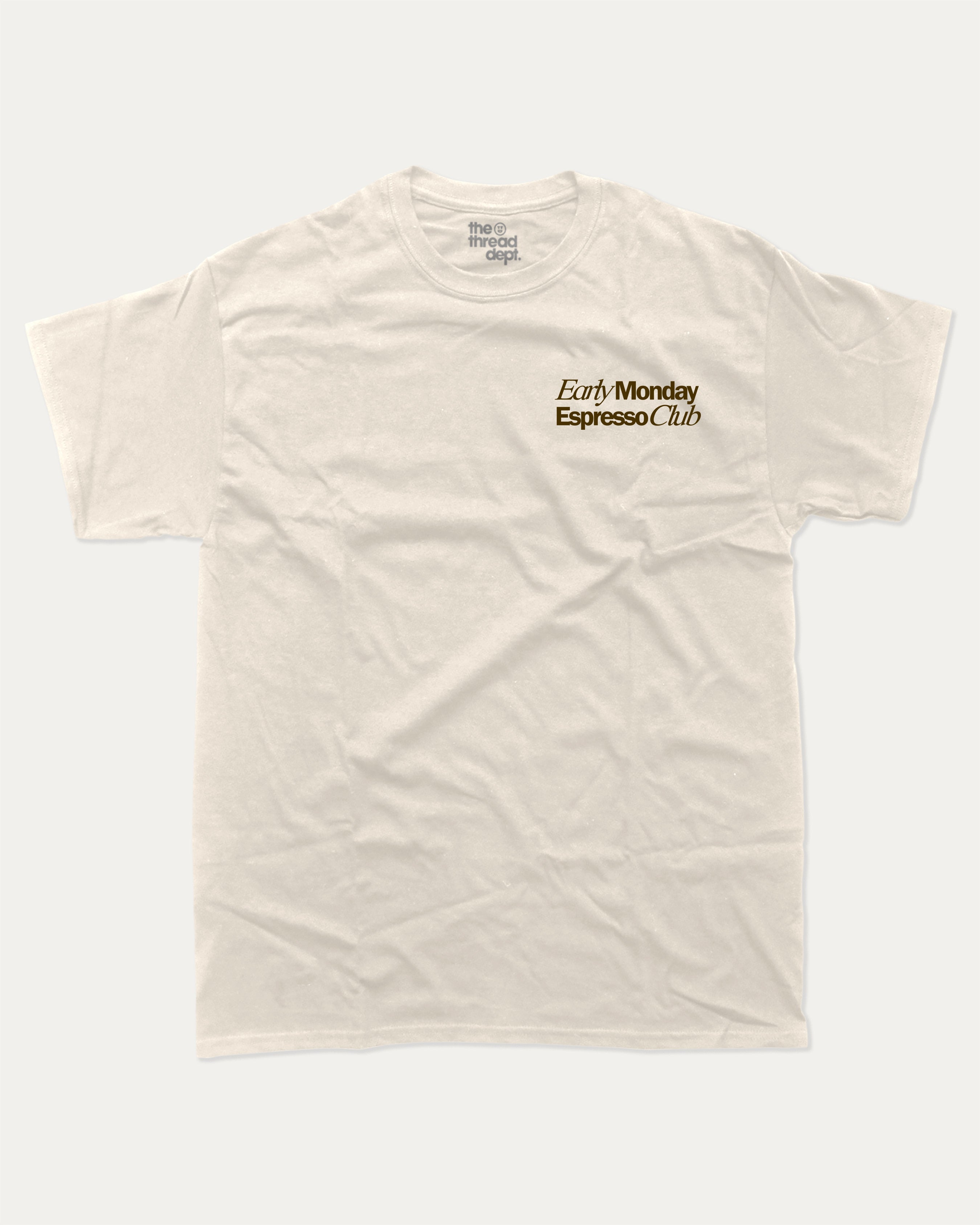 Early Monday Espresso Club graphic tee with bold and humorous print, funny and trendy graphic. Gift for Coffee Lover, Cofee Graphic Tee. Perfect for adults and gift-giving. Cream shirt.