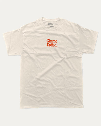 Gimme Coffee graphic tee with bold and humorous print, funny and trendy graphic. Coffee Lover Graphic T shirt, Caffeine Lover Graphic T shirt,  Perfect for adults and gift-giving. Cream shirt.