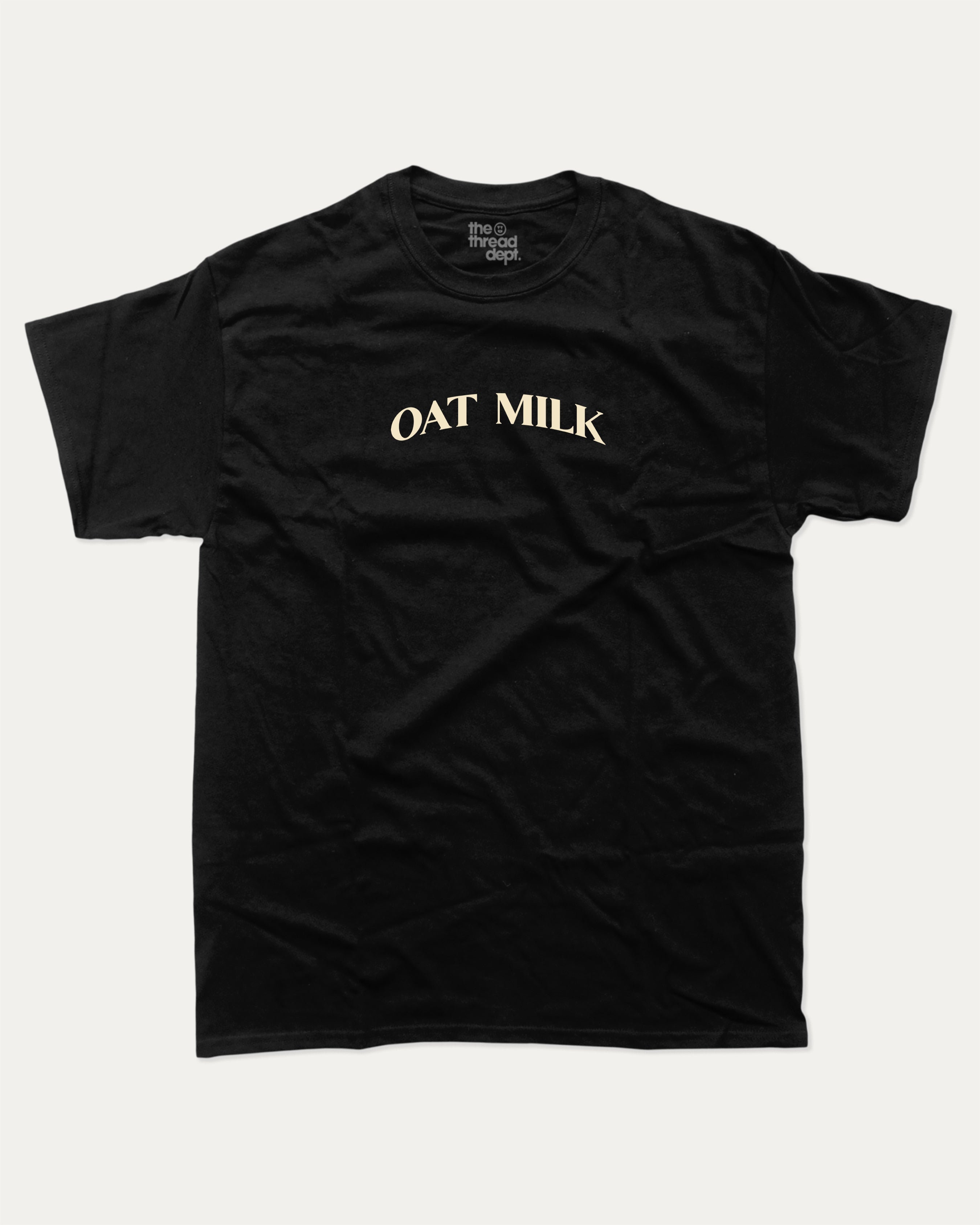 Oat Milk graphic t-shirt with bold and humorous print, funny and trendy graphic. Perfect funny gifts for friends. Black shirt.