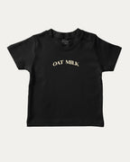 Oat Milk graphic t-shirt with bold and humorous print, funny and trendy graphic. Perfect funny gifts for friends. Black shirt.