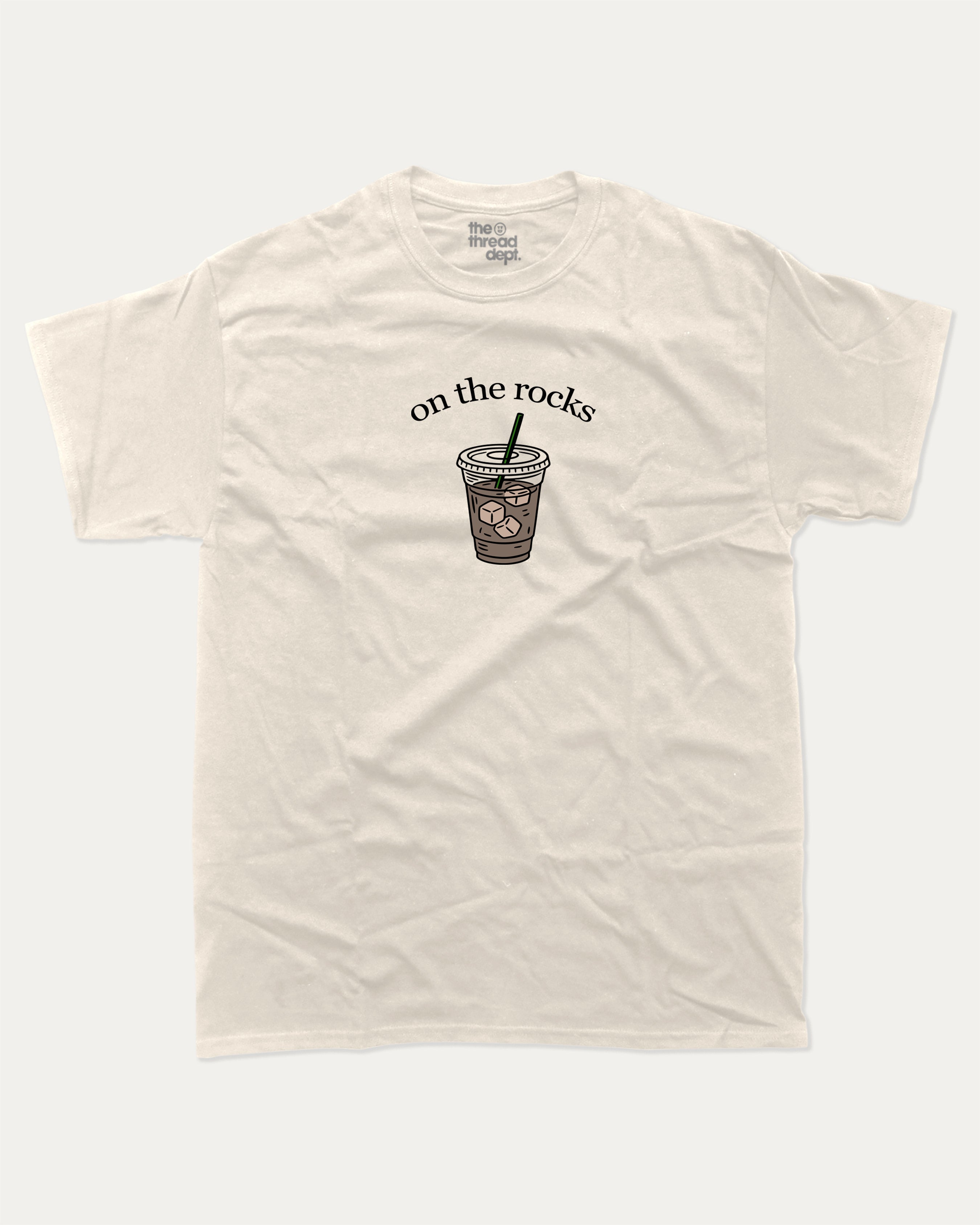 on the rocks graphic tee with bold and humorous print, Perfect Gift for Coffee Lover, Coffee Drinks Graphic T shirt,  funny and trendy graphic. Perfect for adults and gift-giving. Cream shirt.