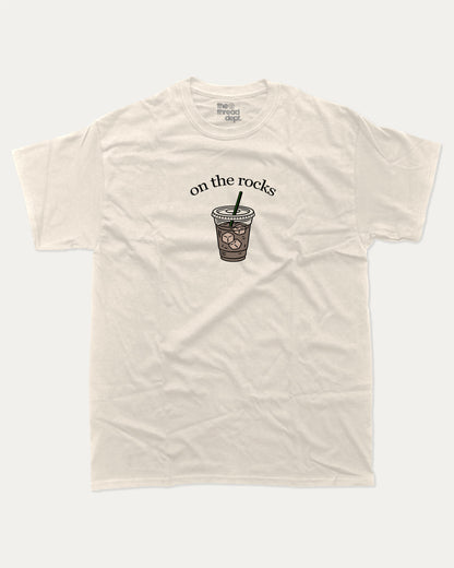 on the rocks graphic tee with bold and humorous print, Perfect Gift for Coffee Lover, Coffee Drinks Graphic T shirt,  funny and trendy graphic. Perfect for adults and gift-giving. Cream shirt.