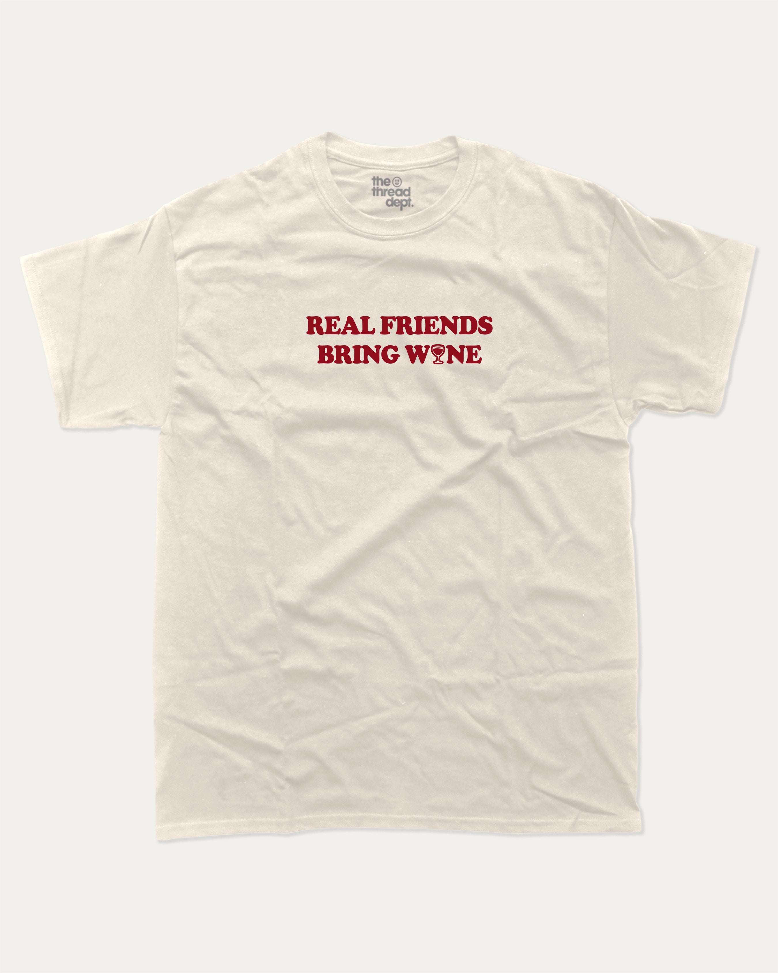 Real Friends Bring wine graphic tee with bold and humorous print, Perfect T shirt for Wine Lover, Wine Graphic T shirt, funny and trendy graphic. Perfect for adults and gift-giving. Cream shirt.