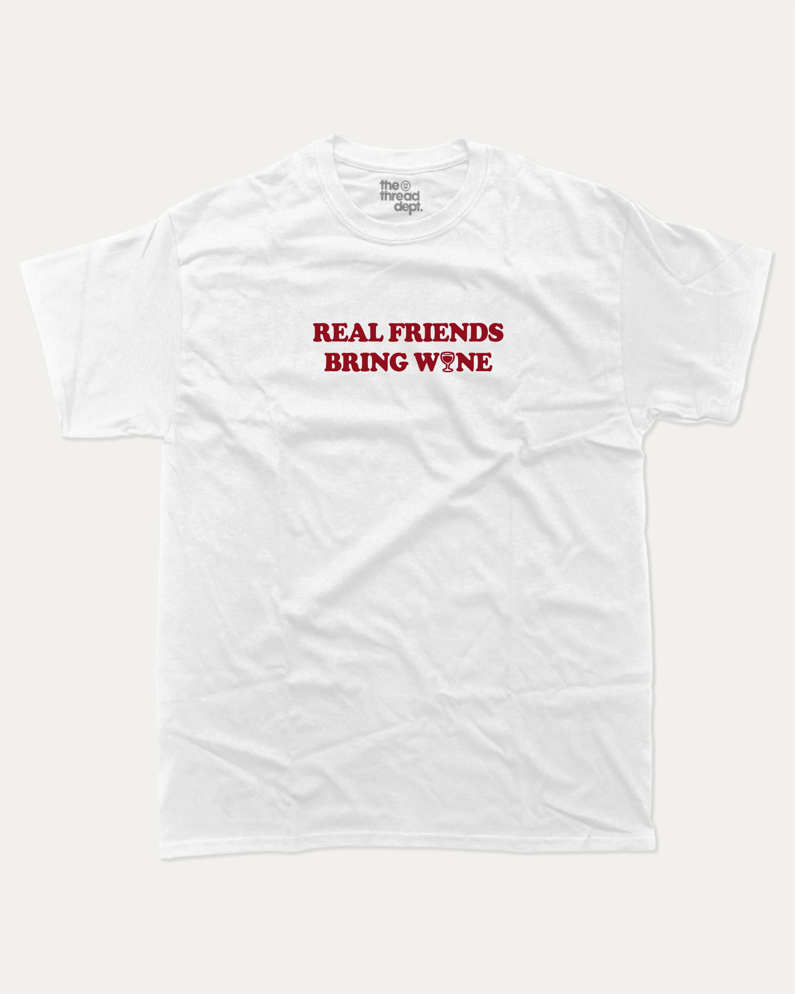 Real Friends Bring wine graphic tee with bold and humorous print, Perfect T shirt for Wine Lover, Wine Graphic T shirt, funny and trendy graphic. Perfect for adults and gift-giving. White shirt.