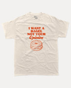 I want a bagel graphic tee with bold and humorous print, Craving Graphic  T shirt, Snack Graphic T shirt, Funny Food Graphic T Shirt, funny and trendy graphic. Perfect for adults and gift-giving. Cream shirt.