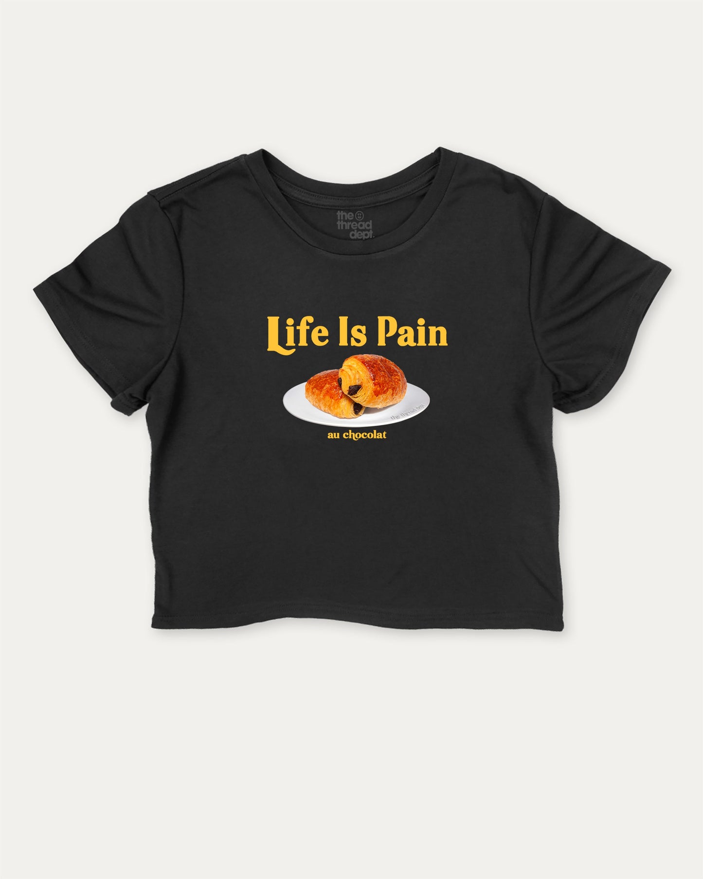 Life Is Pain Au Chocolat cute and trendy crop tee with nostalgic graphic, perfect for women. Funny bread tee shirt, ideal for daily outfits and casual days. Black crop tee