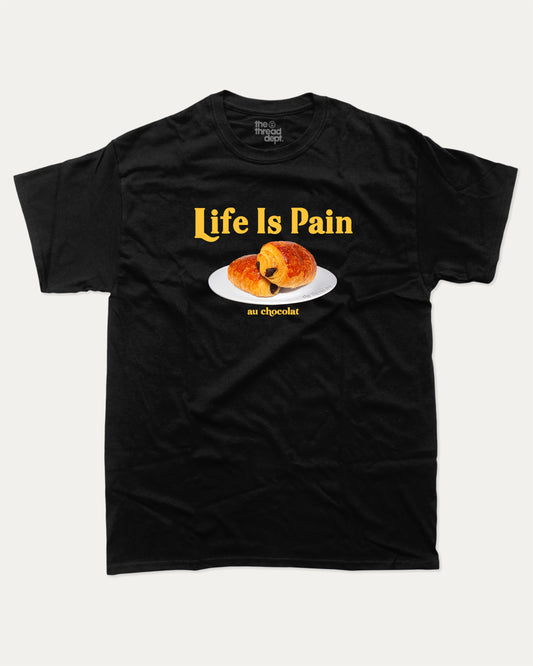Life Is Pain Au Chocolat graphic t-shirt, perfect for adults. Funny bread tee, trending meme shirt, unique gift idea. Black.
