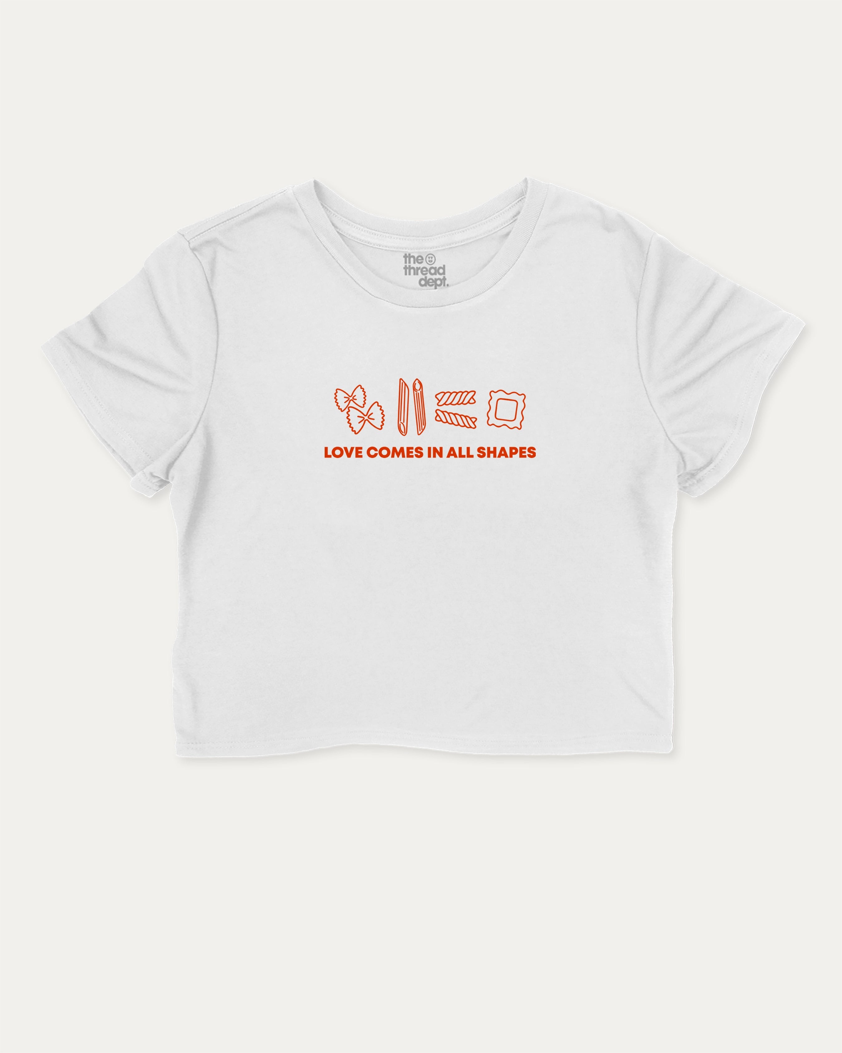 Love Comes In All Shapes graphic crop tee with funny and trendy slogan print, perfect for women’s casual looks or layering. White crop t-shirt.