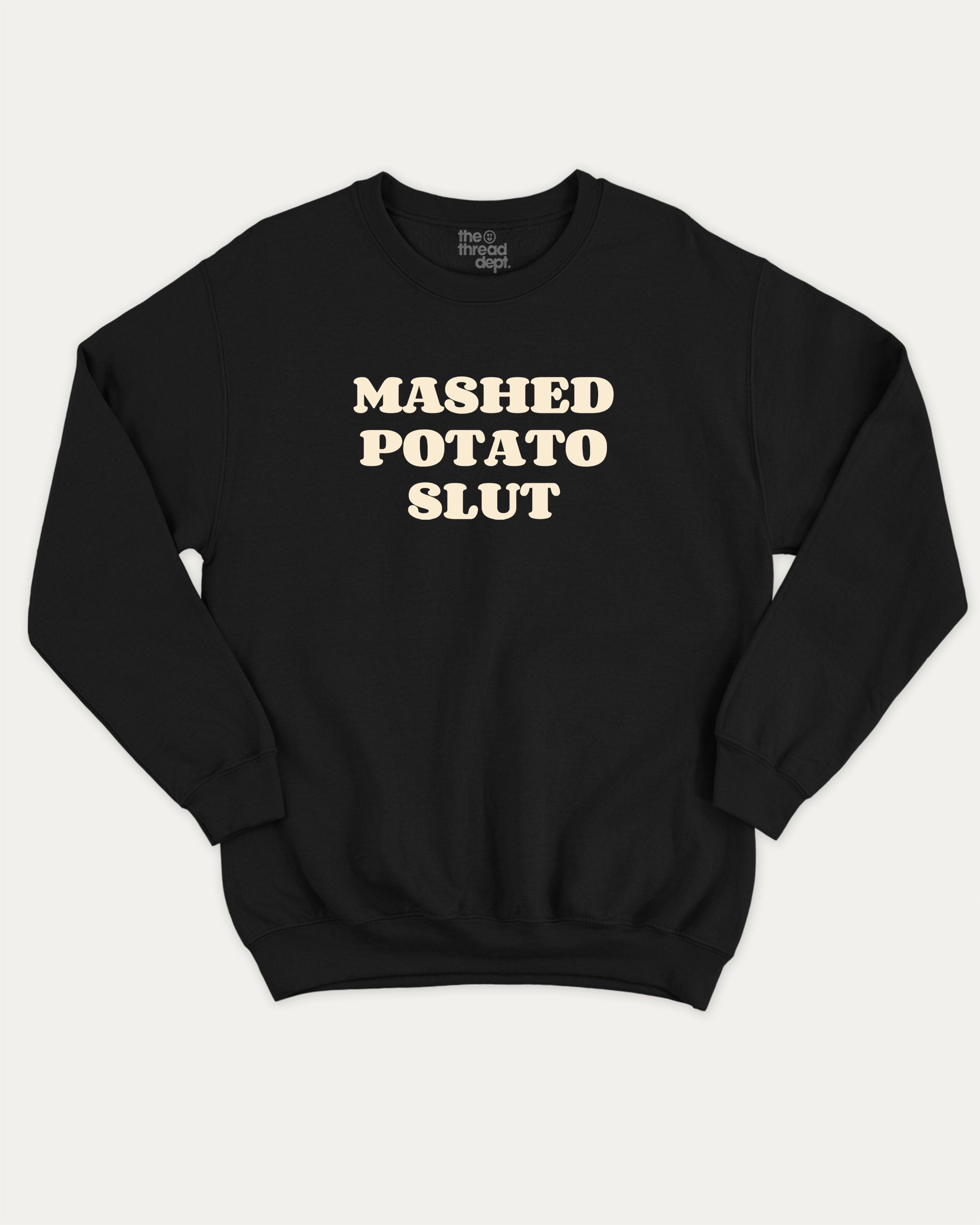 Mashed Potato Slut graphic sweatshirt with bold and humorous print, warm and cozy graphic for everyday wear. Perfect for adults and gift-giving. Black pullover.