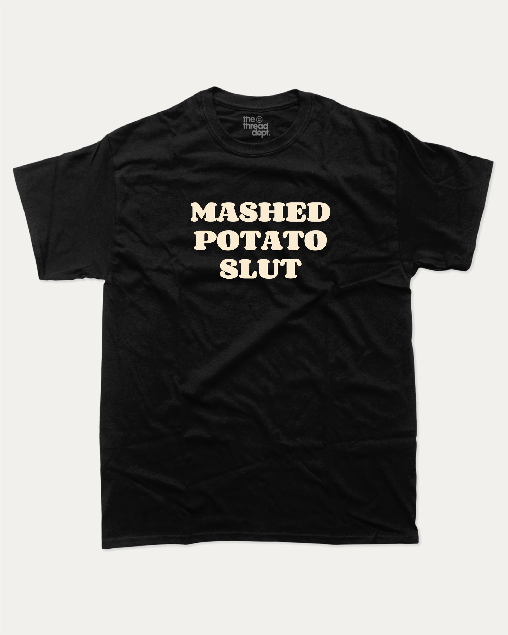 Mashed Potato Slut graphic tee with bold and humorous print, retro mashed potato graphic. Perfect for adults and gift-giving. Black shirt.