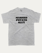 Mashed Potato Slut graphic tee with bold and humorous print, retro mashed potato graphic. Perfect for adults and gift-giving. Heather Grey shirt.