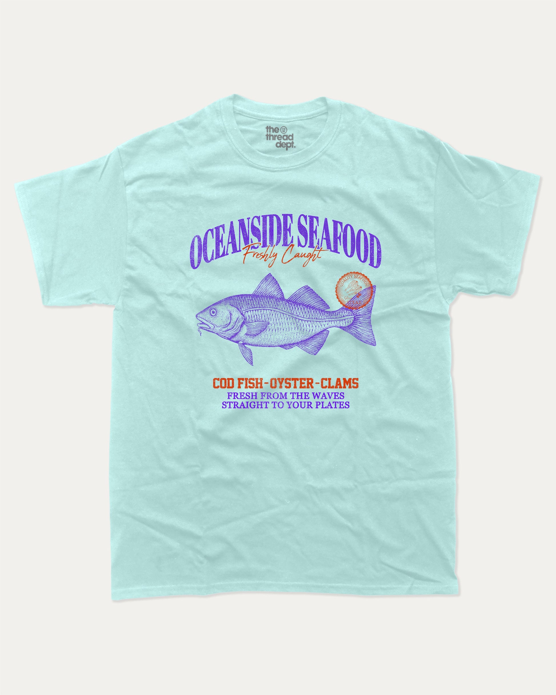 Oceanside Seafood graphic tee with bold and humorous print, Food Graphic Tee, Seafood Lover, Retro Inspired Graphic T shirt, Cute Retro Vintage Graphic T shirt, funny and trendy graphic. Perfect for adults and gift-giving. Celadon shirt.