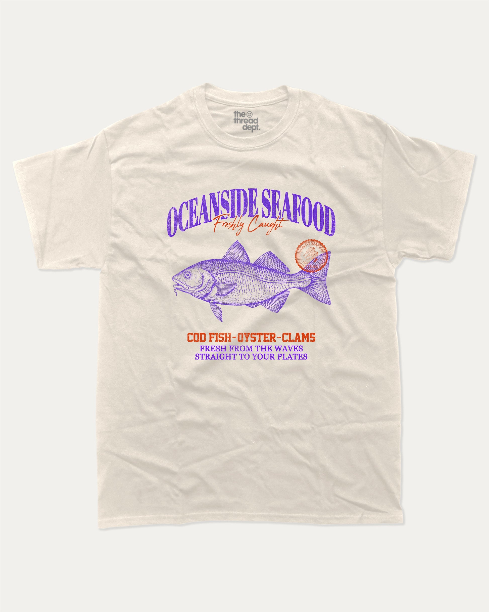 Oceanside Seafood graphic tee with bold and humorous print, Food Graphic Tee, Seafood Lover, Retro Inspired Graphic T shirt, Cute Retro Vintage Graphic T shirt, funny and trendy graphic. Perfect for adults and gift-giving. Cream shirt.