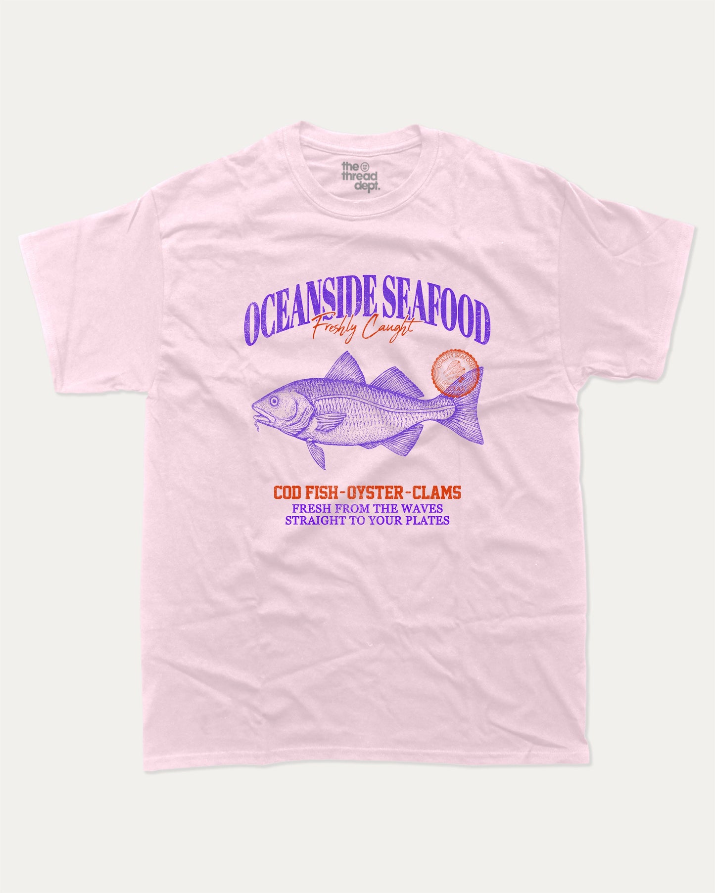 Oceanside Seafood graphic tee with bold and humorous print, Food Graphic Tee, Seafood Lover, Retro Inspired Graphic T shirt, Cute Retro Vintage Graphic T shirt, funny and trendy graphic. Perfect for adults and gift-giving. Pink shirt.