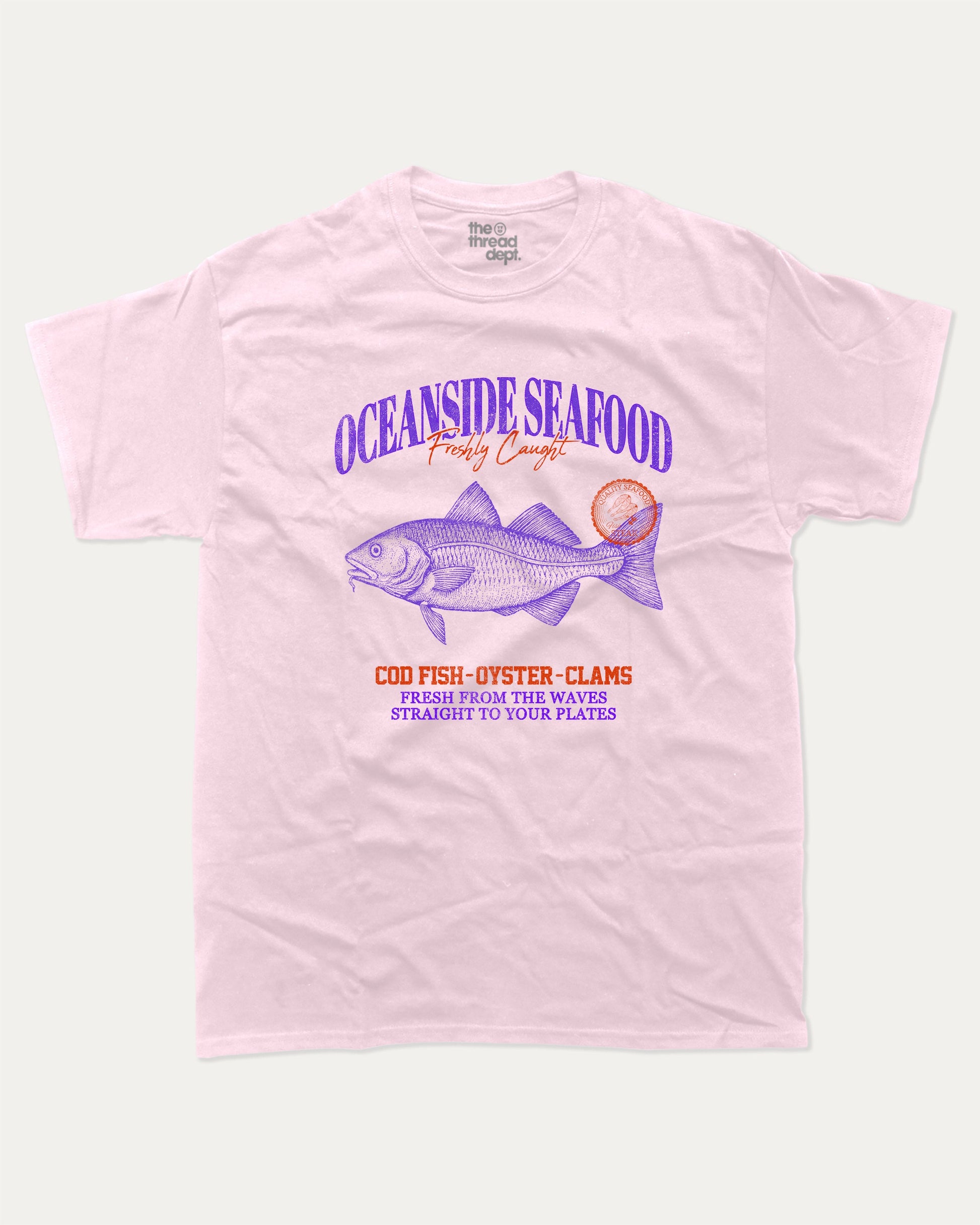 Oceanside Seafood graphic tee with bold and humorous print, Food Graphic Tee, Seafood Lover, Retro Inspired Graphic T shirt, Cute Retro Vintage Graphic T shirt, funny and trendy graphic. Perfect for adults and gift-giving. Pink shirt.