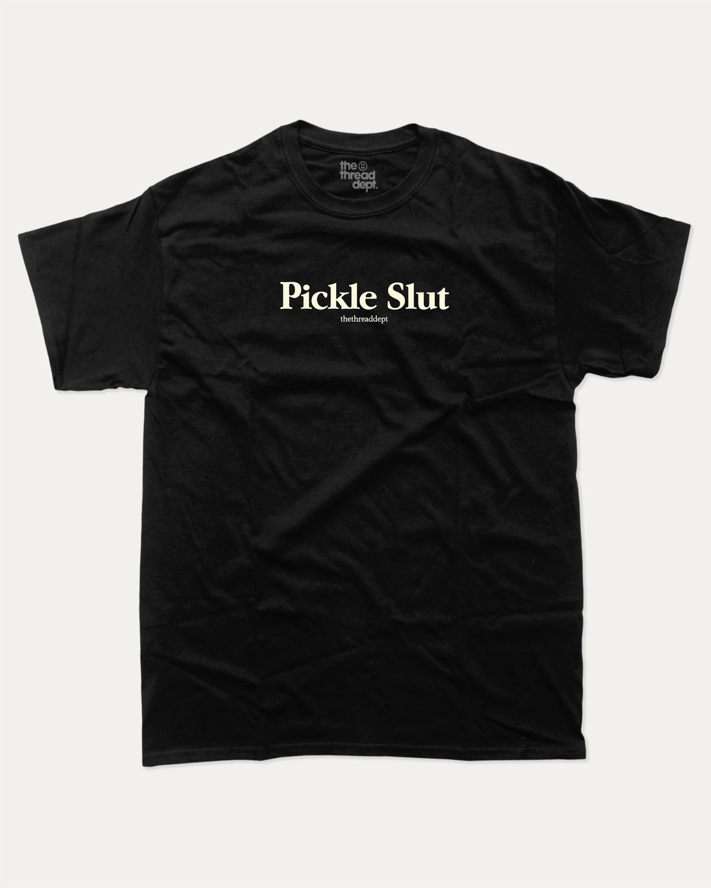 Pickle Slut graphic tee with bold and humorous print, funny and trendy graphic. Perfect Gift for Food Lover, Pickle Graphic T shirt, Craving Graphic T shirt, Snack Graphic T shirt,  Perfect for adults and gift-giving. Black shirt.