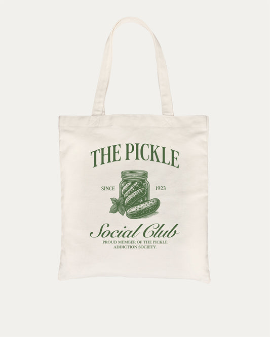 The Pickle Social Club cotton canvas tote bag with humorous graphic. Funny pickle graphic t-shirt – the perfect quirky gift for pickle lovers who enjoy playful fashion and lighthearted style.