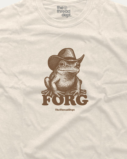 Beige t-shirt with a frog wearing a cowboy hat and 'FORG' text, brand 'the thread dept.' visible.