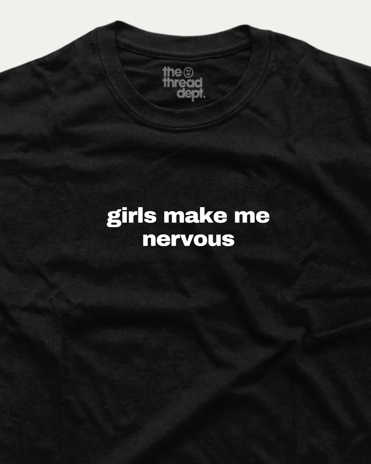 Black t-shirt with 'girls make me nervous' text and 'the thread dept.' branding.