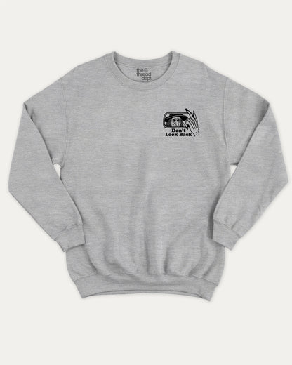 Don't Look Back graphic sweatshirt with bold and humorous print, warm and cozy graphic for everyday wear. Perfect for adults and gift-giving. Heather Grey pullover.